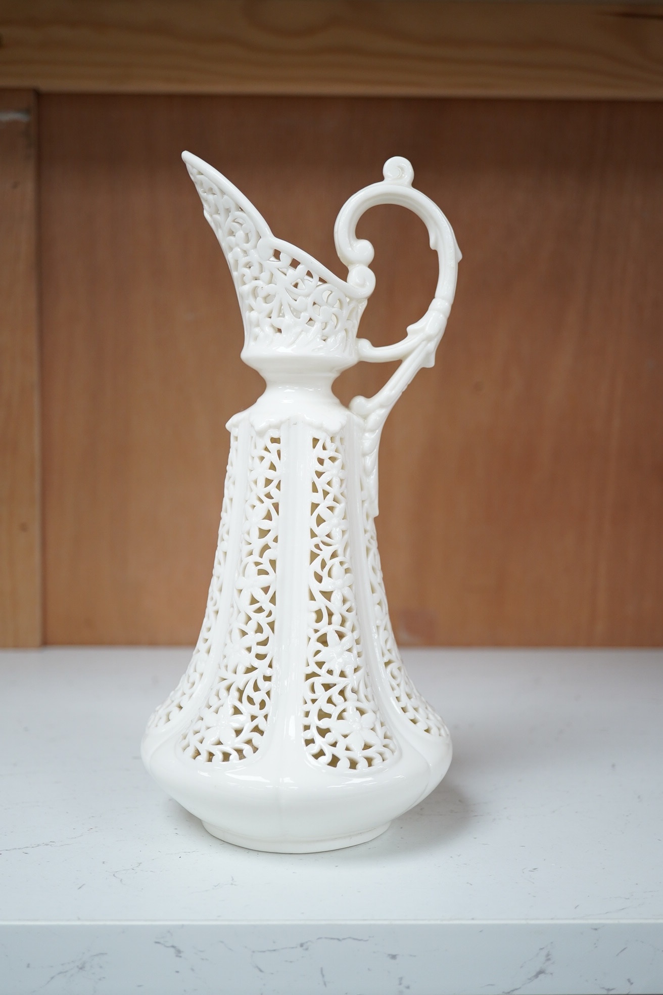 A Grainger's reticulated ewer, 23cm high. Condition - good